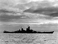 Photo # NH 45486: USS New Jersey silhouetted against the sea and clouds, Oct. 1943