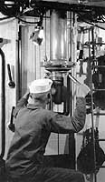 Photo # NH 46759: Demonstrating a periscope on board USS H-5, circa 1919