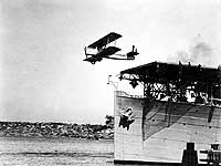 Photo # NH 47024: DT-2 torpedo plane takes off from USS Langley, at San Diego, Calif., circa 1925