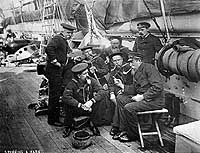 Photo # NH 47029-A: 'Spinning a Yarn' -- sailors telling tall tales on board USS Enterprise, circa spring 1890