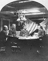 Photo # NH 48028: Captain Stephen B. Luce with other officers in the Captain's cabin of USS Hartford, 1 March 1877