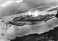 Photo # NH 50930:  Japanese planes attack ships on both sides of Ford Island, Pearl Harbor, 7 December 1941.