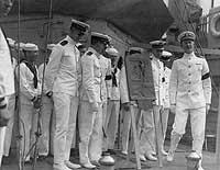 Photo # NH 52230:  Officers and crewmen with the engineering efficiency trophy won by USS Kane, 1923