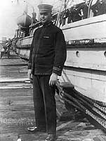 Photo # NH 71504:  Lt. Ernest L. Jones standing by USS Conestoga, circa early 1921