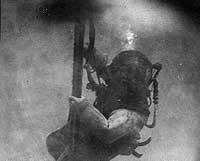 Photo # NH 74731: Diver descending to the sunken submarine USS F-4, off Honolulu, 1915