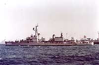 Photo # NH 99768:  USS Rich anchored outside the harbor of Mogadiscio, Somalia, during a port call in February 1966.