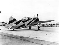 Photo # NH 96146: Brewster F2A-1 wearing McClelland Barclay camouflage design # 2, September 1940