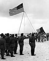Photo # NH 96813: Raising the U.S. flag over Wake Island, Sept. 1945