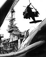 Photo # NH 96995:  Marine F4U fighters are loaded onto USS Badoeng Strait for transportation to Korea, July 1950