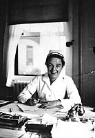 Photo # NH 97261: Navy Nurse Madeline Clara Lassuy at her desk at the U.S. Naval Hospital, San Diego, California, 1939