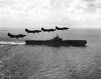 Photo # NH 97281: F9F jet fighters fly past USS Boxer, off Korea, June 1951