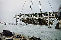 Photo # NH 97357-23-KN: Confederate Submarine H.L. Hunley, just after it was raised from the sea bottom, 8 Aug. 2000