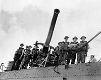 Photo #  NH 97446: USS Ward's number three gun and its crew, which fired the first shot of the Pacific War, 7 December 1941.
