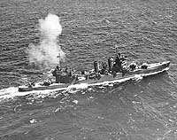 Photo # NH 97683:  USS Astoria firing her after 8-inch guns, 1942