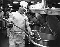 Photo # NH 98322:  Preparing the evening mean in USS Hull's galley, Sept. 1975