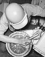 Photo # NH 98861:  Removing an engine order telegraph from ex-USS Galveston, circa 1973-1975