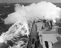 Photo # NH 99024:   USS Spokane in heavy North Atlantic seas, circa October 1946