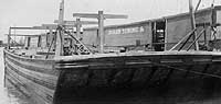 Photo #  NH 99343:  Moran Co. Barge # 76 under construction at Tottenville, N.Y., 1918, with Barge # 72 partially visible in the left background