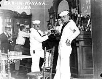 Photo # NH 99720: Two of USS Hannibal's Petty Officers in a Havana Bar, during the 1920s
