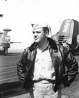 Photo # NH 103825: Lieutenant Commander James L. Holloway, III, on board USS Boxer, 1952