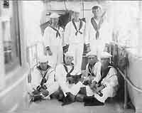 Photo # NH 103833:  Signal boys and Quartermasters of USS Yorktown, Abraham DeSomer among them, 1902