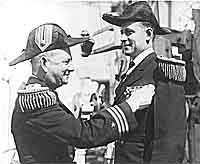 Photo # NH 103893:  LCdr. Paul F. Foster receives a decoration.