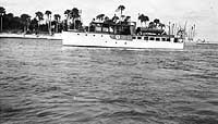 Photo # NH 104063:  Motor boat Elf in a tropical harbor, circa early 1917.  She was USS Elf (SP-81) in 1917-1919