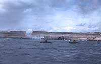 Photo # NH 104354-KN: LSMs on Iwo Jima's eastern beaches, 19 February 1945.  Photographed by Lt. Howard W. Whalen, USNR