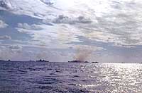 Photo # NH 104376-KN: Warships bombarding Iwo Jima, circa 19 February 1945.  Photographed by Lt. Howard W. Whalen, USNR