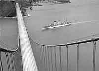 Photo # NH 104664:  USNS General M. C. Meigs passes under the Golden Gate Bridge, bound for to the Far East, circa 1950-1953.