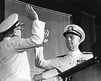 Photo # NH 104901:  Admiral Thomas H. Moorer takes the oath of office as Chief of Naval Operations, 1 August 1967