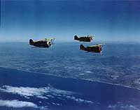 Photo # 80-G-K-16431:  Three F3F-3 fighters fly in formation, circa 1939-40