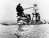 Photo # 80-G-1021538:  The burned-out sunken wreck of USS Arizona, some days after the 7 December 1941 Japanese raid on Pearl Harbor.