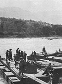 South African Engineers constructing a pontoon bridge over the fast--flowing Omo River in June 1941.