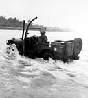 WATERPROOFED JEEP heading from ship to shore during the Kwajalein battle