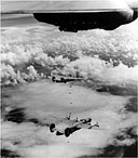 CONSOLIDATED LIBERATOR HEAVY BOMBERS, B-24's, raining 500-pound bombs on Truk