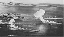 ENEMY SHIPS ON FIRE, the result of direct hits during the 17-18 February air raid on Truk