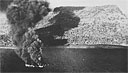ENEMY SHIPS ON FIRE, the result of direct hits during the 17-18 February air raid on Truk