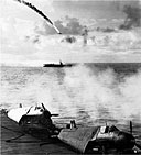 JAPANESE DIVE BOMBER PLUNGING TOWARD THE SEA, downed by antiaircraft fire from a Navy carrier