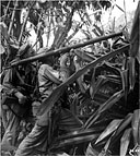 2.36-INCH ROCKET LAUNCHER M9 being fired into a cave on Saipan