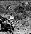 MEDIUM TRACTOR M5 dragging sleds of ammunition to the front