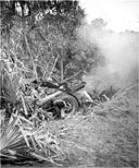 155-MM. HOWITZER M1918 firing on Japanese positions