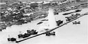 JAPANESE SHIPPING in a northern Honshu harbor during a U.S. carrier-based aircraft attack