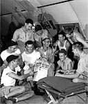 U.S. PERSONNEL STATIONED ON GUAM discussing the news of the first atomic bomb dropped on Japan