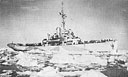 SURROUNDED BY VAST FIELDS OF FLOATING ICE THE COAST GUARD COMBAT CUTTER <i>MOJAVE</i> FEELS ITS WAY TOWARD AN OBjECTIVE IN THE FAR NORTH