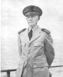 REAR ADMIRAL MERLIN O'NEILL, ASSISTANT COMMANDANT OF THE COAST GUARD PICTURED ON BOARD THE ASSAULT TRANSPORT, Leonard Wood, WHICH HE COMMANDED (IN THE RANK OF CAPTAIN) DURING OPERATIONS AGAINST NORTH AFRICA, SICILY, AND IN THE SOUTH PACIFIC