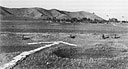 Arrow, made of blankets and clothing, directs Corsairs to village from which Chinese Communists fired upon a Marine patrol