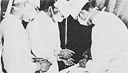 Hospital Corpsmen in a field unit assist the battalion surgeon in an
emergency midnight operation.