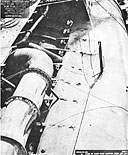 Photo 9-6: Scamp (SS277). View of port side, looking down and aft, showing partial collapse of the engine air induction piping.