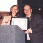 Dana Gordon, left, with Newsweek, presenting the Agnes Henebry Roll of Honor award to Gary Price, right, (Gary Price Library Research and Internet Consulting). Photo by Ron Larson (From The Barbara Semonche Files)